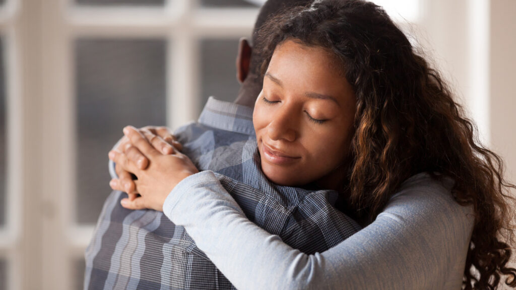 man and woman hugging after navigating addiction and relationships